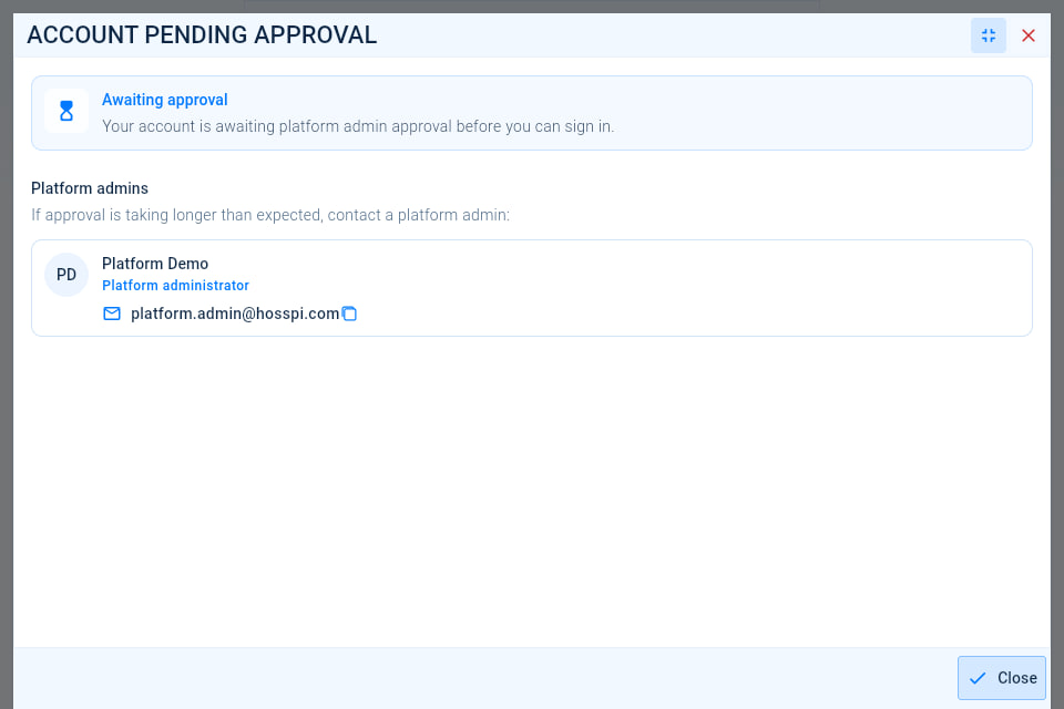 The Awaiting approval message, explaining that a platform administrator must approve the account, with the platform administrators to contact and a Close button.